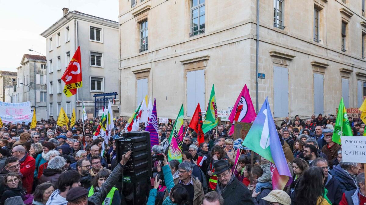 Protesters gather in front of the Deux-Sevres prefecture during a demonstration in support to victims of police brutality, after events in Sainte-Soline and in pension protests, in Niort, western France, on Thursday. - AFP