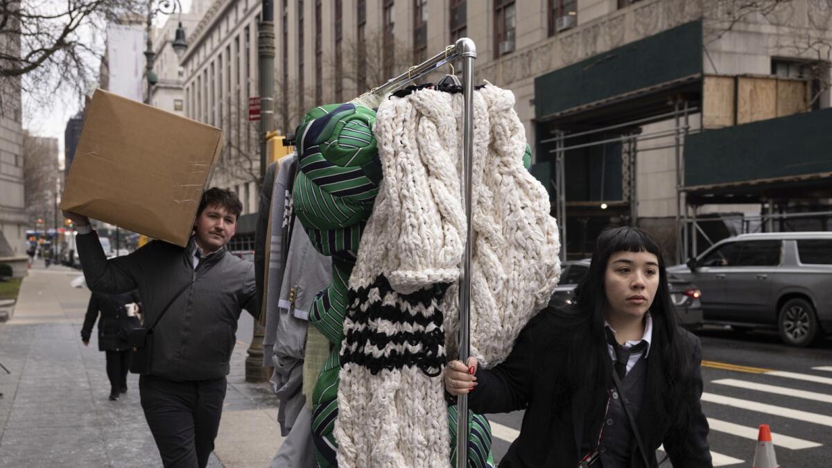 Clothes by fashion designer Thom Browne is taken into Manhattan federal court, Monday, Jan. 9, 2023, in New York