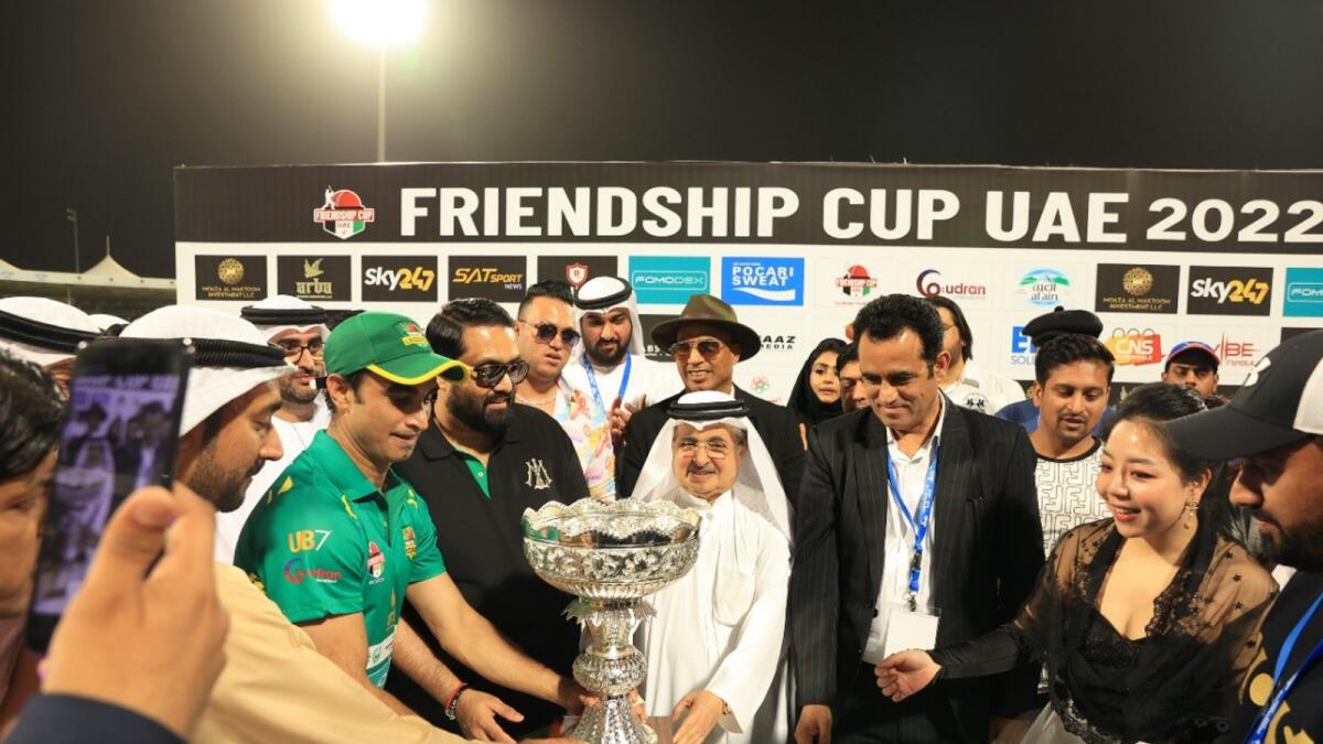 HH Sheikh Faisal bin Khalid Al Qassimi, chief guest and the chief patron of the UAE Friendship Cup, hands over the UAE Friendship Cup to Pakistan Legends. — Supplied photo