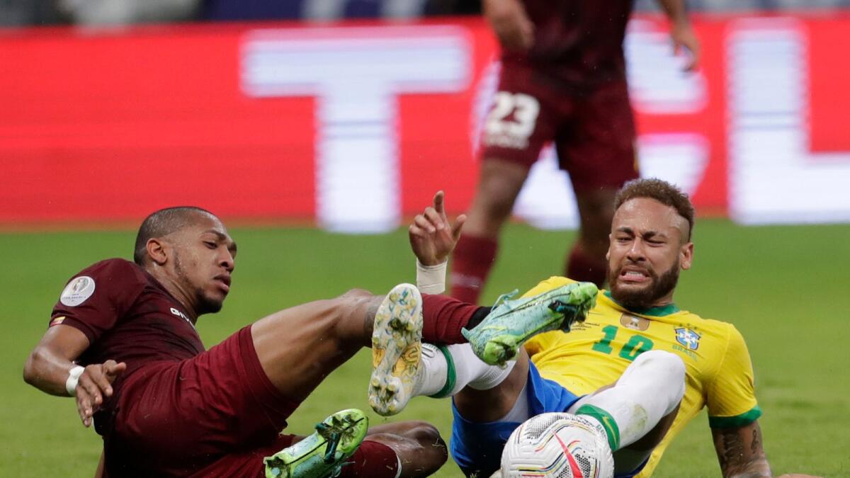 Brazil's Neymar (right) and Venezuela's Jose Martinez battle for the ball during their Copa America match in Brasilia. (AP)