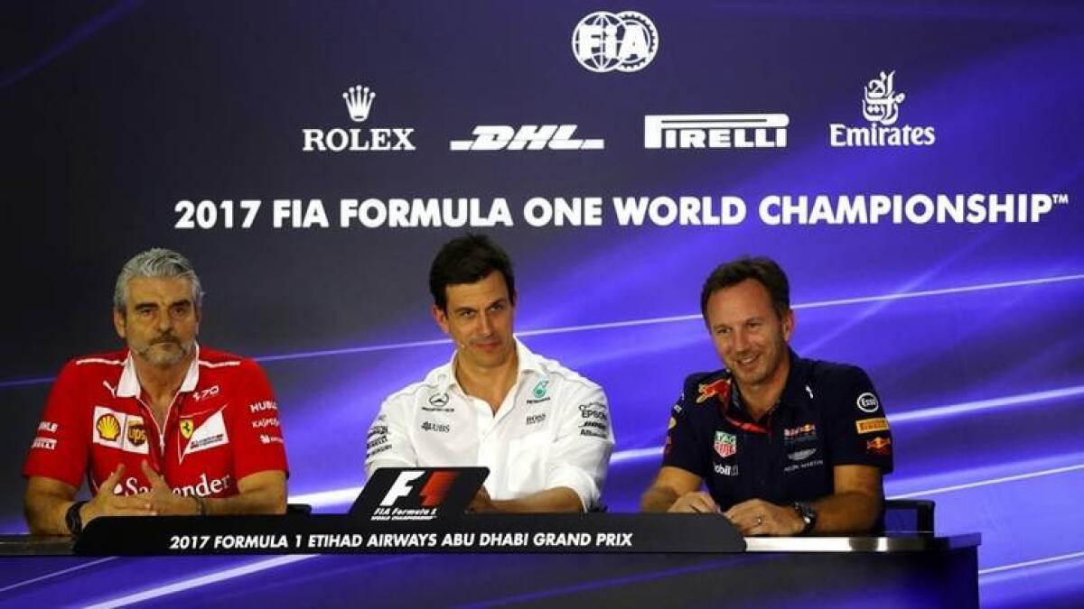 Mercedes team chief Toto Wolff (centre) and Red Bull counterpart Christian Horner (right). - Agencies
