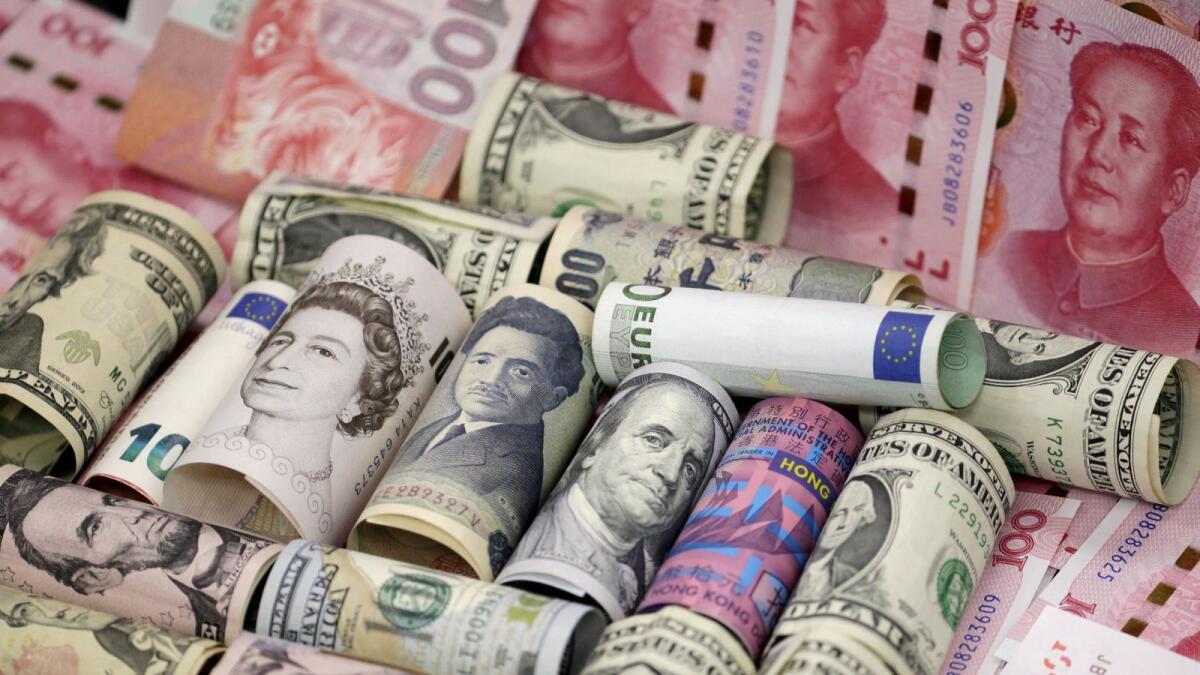 Euro, Hong Kong dollar, US dollar, Japanese yen, pound and Chinese 100 yuan banknotes are seen in this picture illustration, in Beijing. - Reuters file
