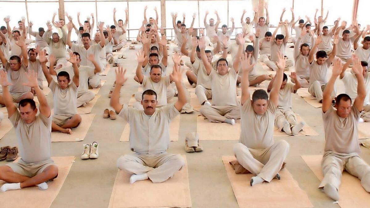 Inmates in Argentina do breathing exercises and meditation as part of the Prison SMART healing programme. —Supplied photo