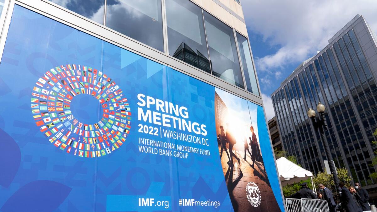 Delegates arrive at the International Monetary Fund (IMF) building, during the World Bank/IMF Spring meetings in Washington. The IMF, which has already deployed $300 billion out of the $1 trillion it pledged last year to help global economies during the pandemic, is stepping up to help member countries on all the fronts. — AP