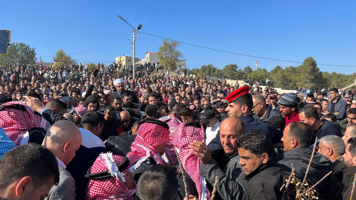 People gather during the funeral of senior police officer who was killed in protest on Thursday night  in Jerash, Jordan, on Friday. — Reuters