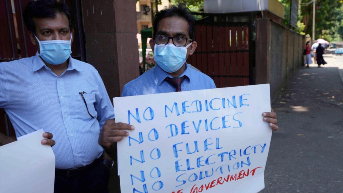 Sri Lankan government medical officers protest outside the national hospital in Colombo. — AP