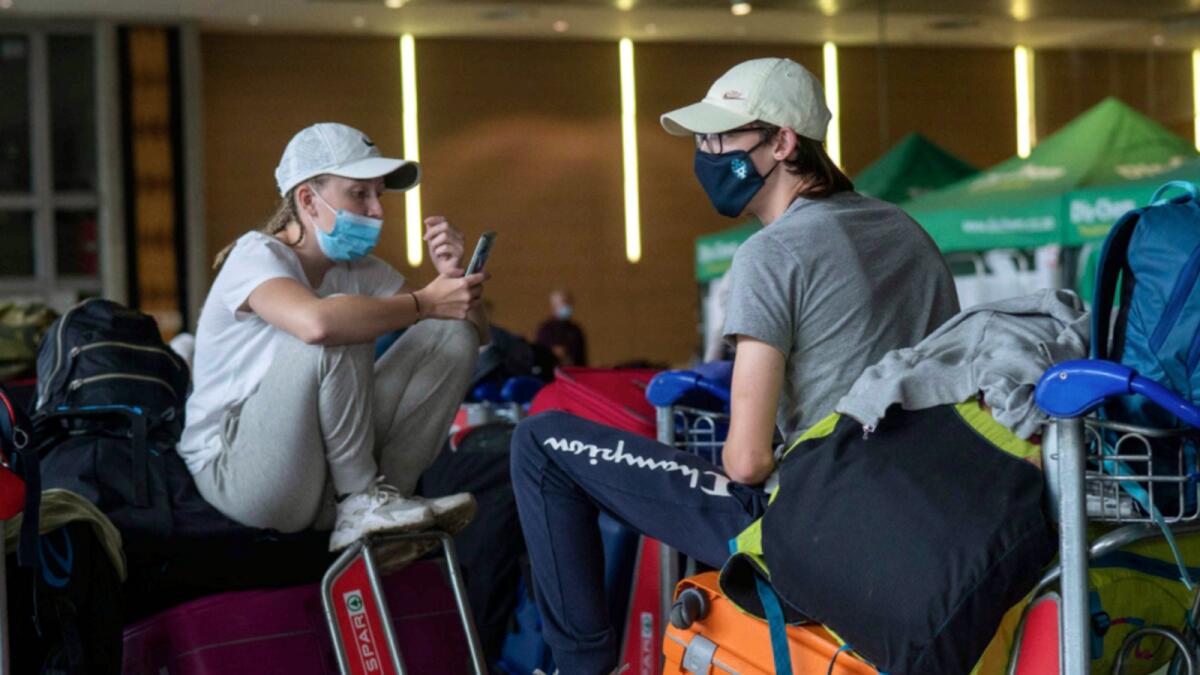 Students from Norway who were on a field trip to South Africa wait to be tested for Covid-19 before boarding a flight to Amsterdam at Johannesburg's OR Tambo's airport. — AP