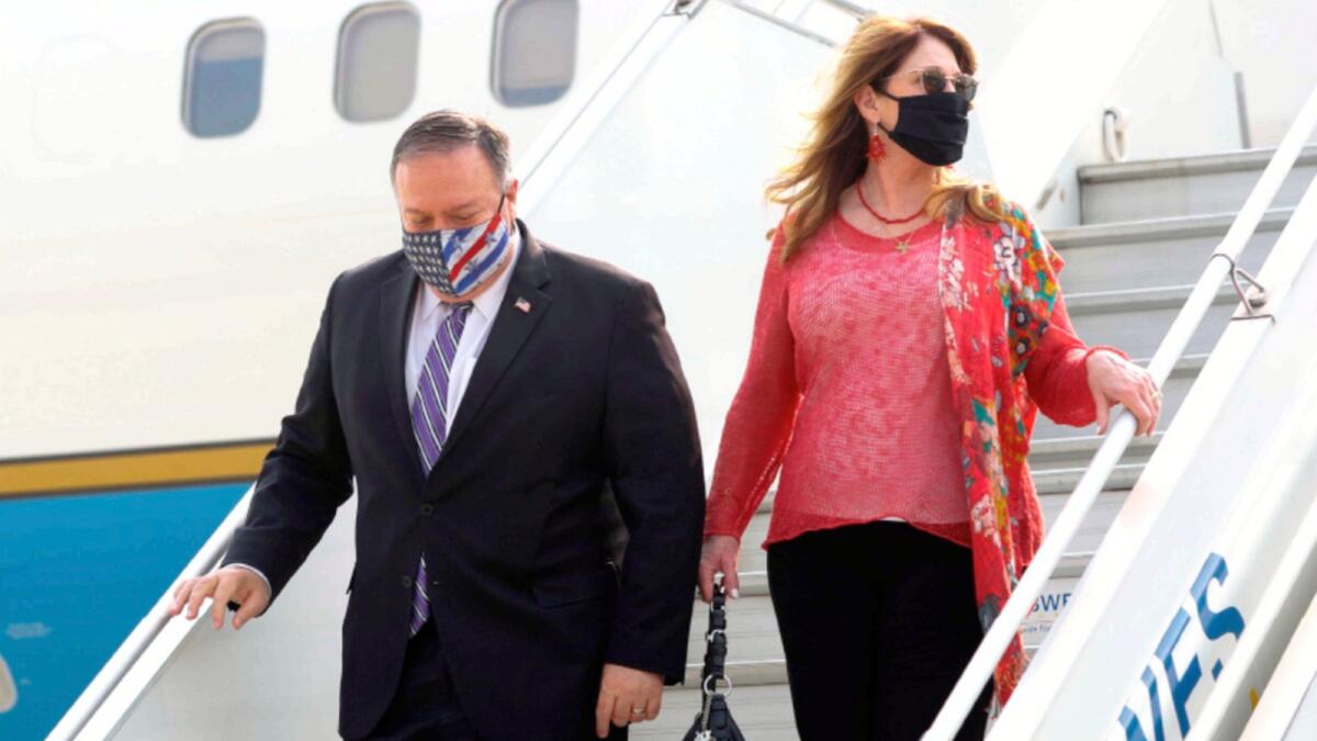 US Secretary of State Mike Pompeo and his wife Susan disembark from an aircraft upon their arrival in New Delhi on Monday. — AFP