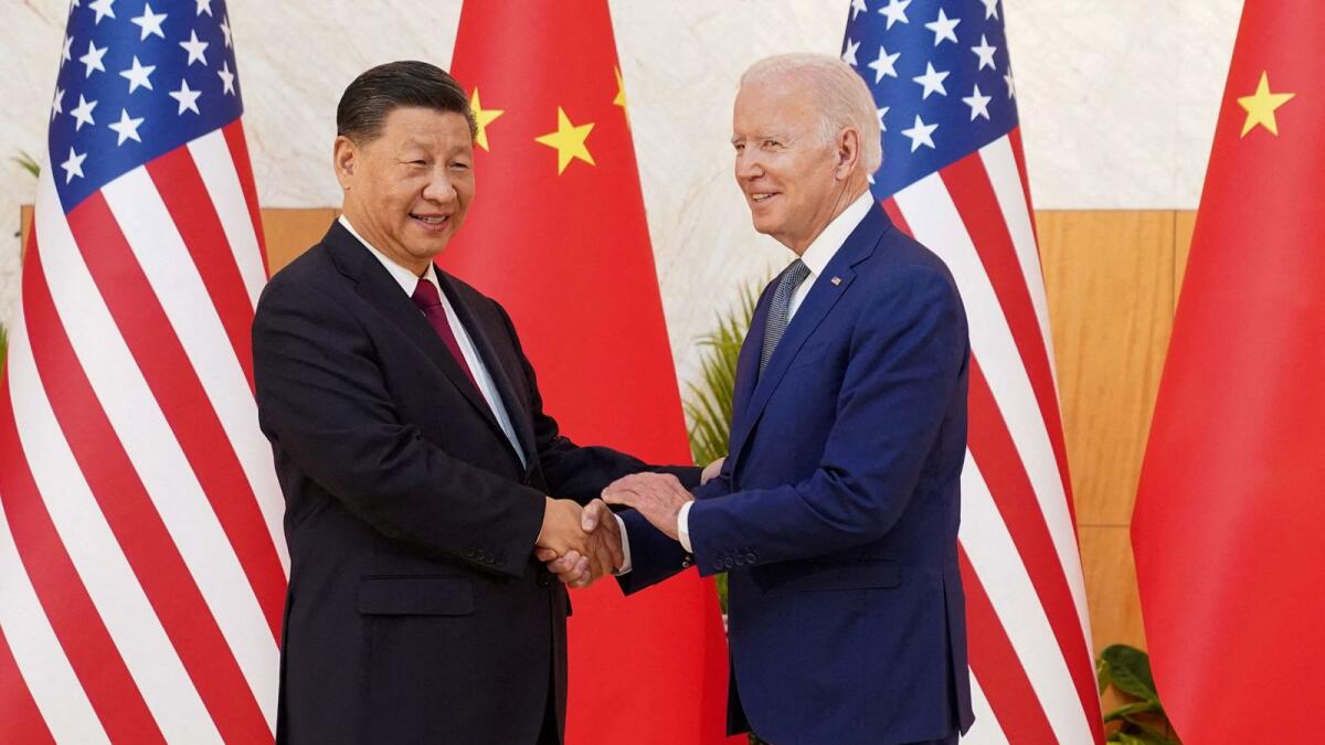 Joe Biden shakes hands with Xi Jinping as they meet on the sidelines of the G20 leaders' summit in Bali. — Reuters