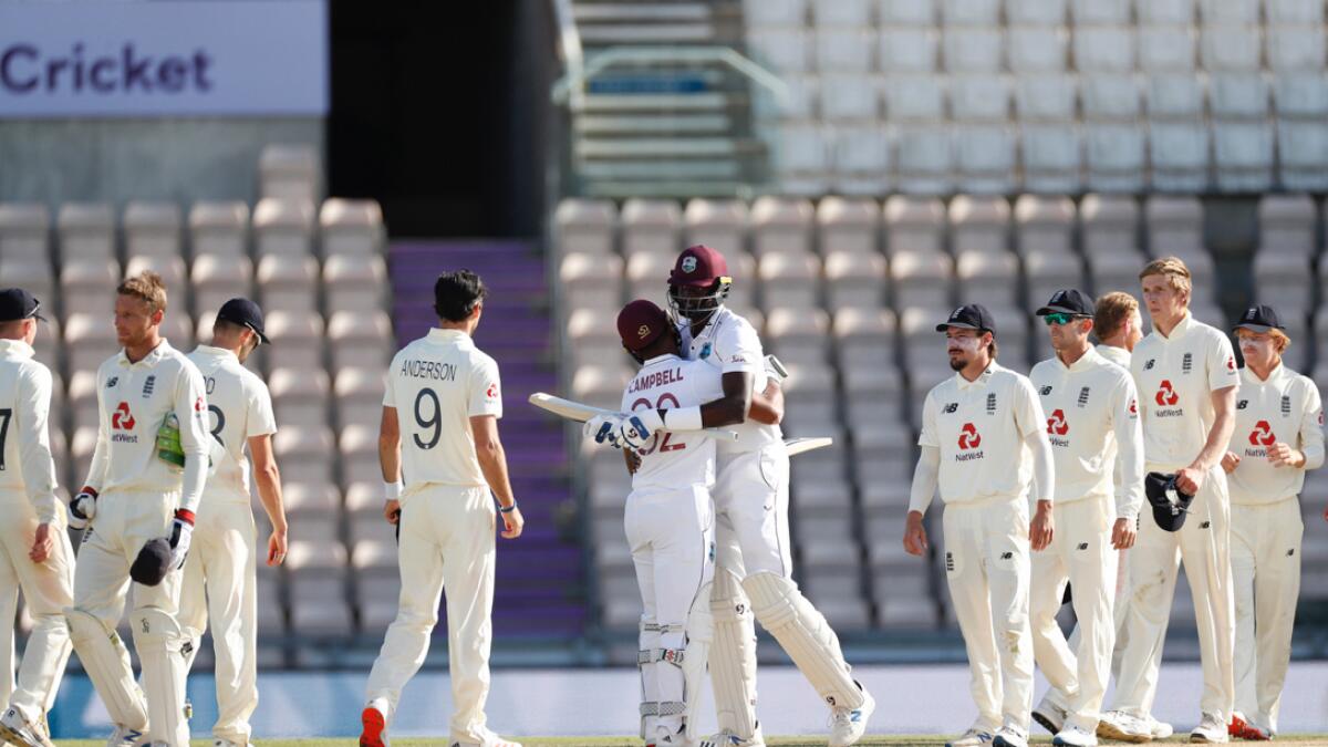 West Indies captain Jason Holder (centre right) hugs teammate John Campbell after their win on the fifth day of the first cricket Test match between England and West Indies, at the Ageas Bowl in Southampton, England, Sunday, July 12, 2020. Photo: AP