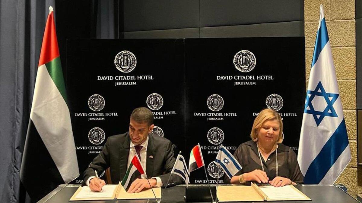 Dr. Thani bin Ahmed Al Zeyoudi, UAE’s Minister of State for Foreign Trade, signs the UAE-Israel Cepa with the Israeli representative. - Courtesy: twitter