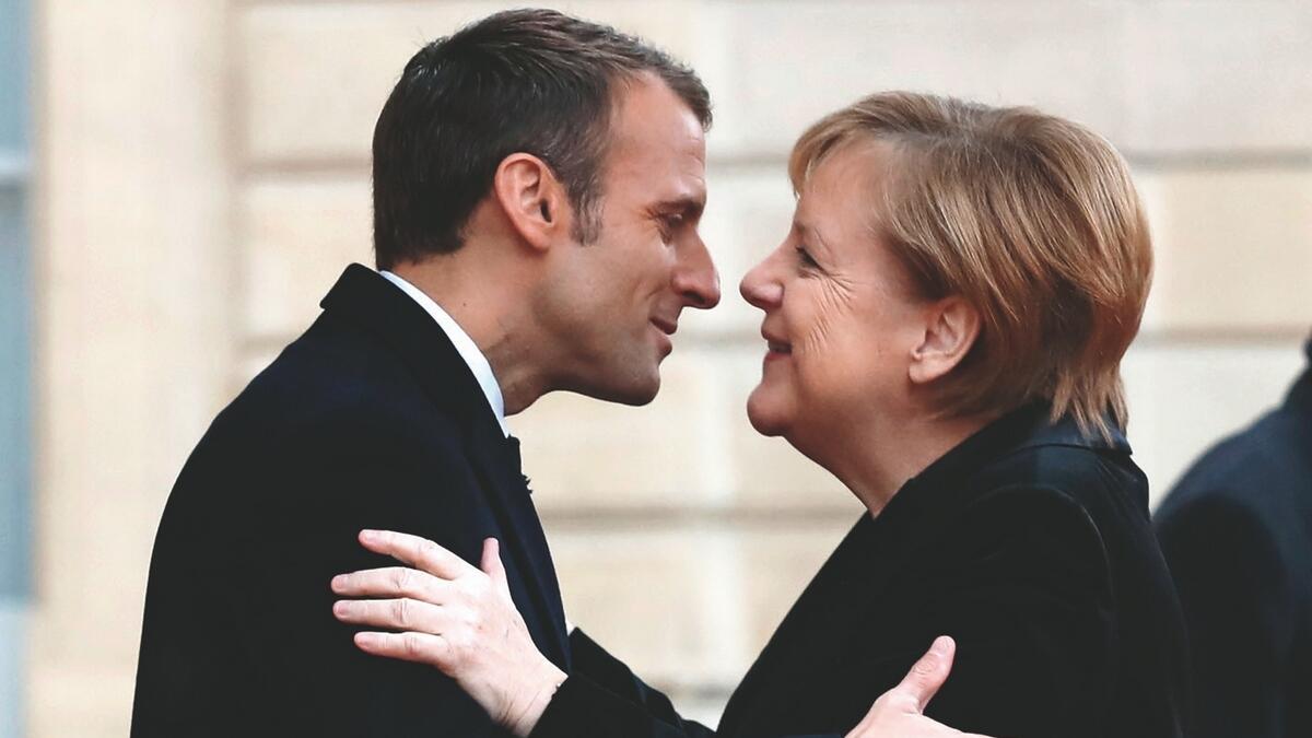 Macron, Merkel eye common approaches to Trump, euro