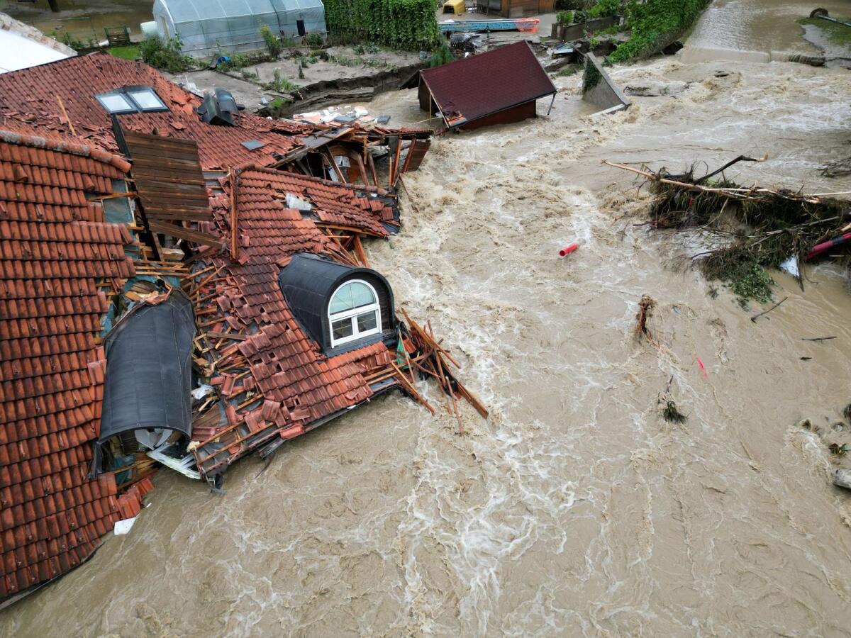 A view of a damaged building in a flooded area, following heavy rains, in Prevalje, Slovenia August 6, 2023. Photo: Reuters