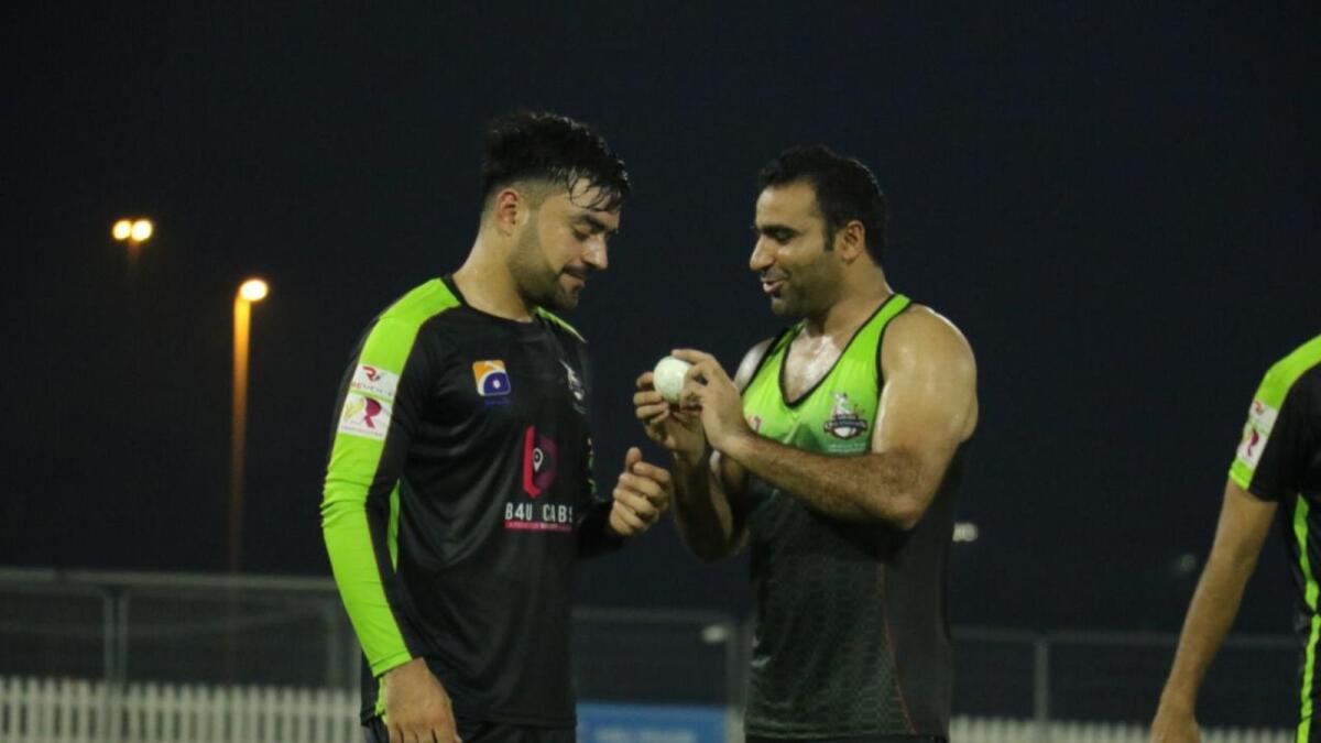Sultan Ahmed with Rashid Khan during a Lahore Qalandars practice session. (Supplied photo)