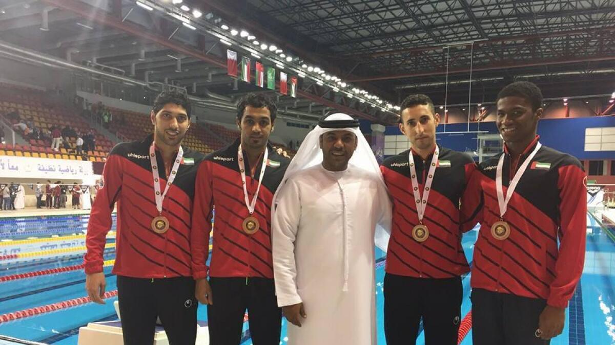 UAE swimmers savour their Gulf championship success. 