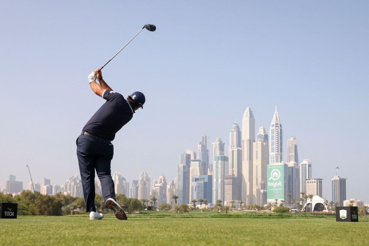 Patrick Reed of the US tees off during the final round of the Dubai Desert Classic. — AFP
