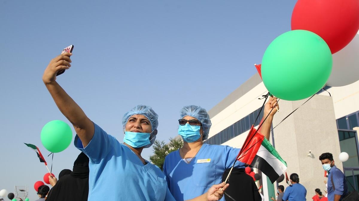 Hospital staff celebrated as Al Fursan team fly over the hospital.  Photo by Juidin Bernarrd
