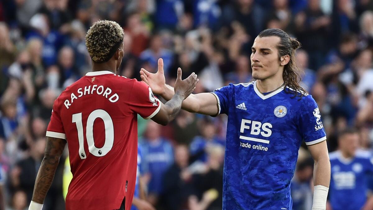 Leicester's Caglar Soyuncu (right) greets Manchester United's Marcus Rashford after the match. (AP)