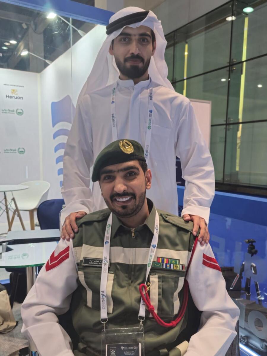 Cpl Murad Abbas Murad (seated) with his brother who also works with the Dubai Police