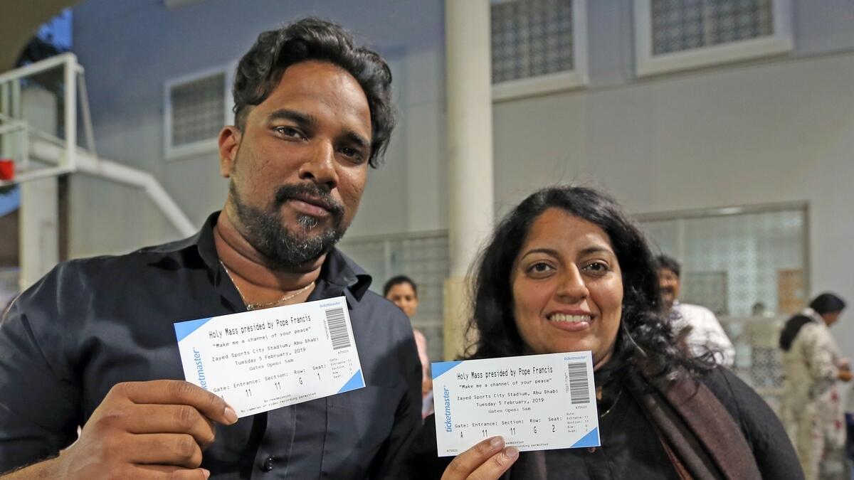 Thomas Anthony and Ruby Elsa Anthony poses with their ticket for the upcoming Papal Mass.-Photo by Dhes Handumon