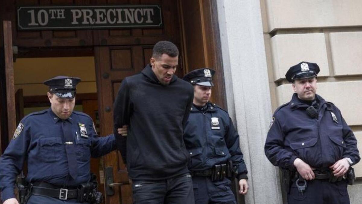 NBA player Thabo Sefolosha escorted out of the 10th Precinct of the New York Police Department (NYPD) in Manhattan, New York, on April 8, 2015 (Reuters file)