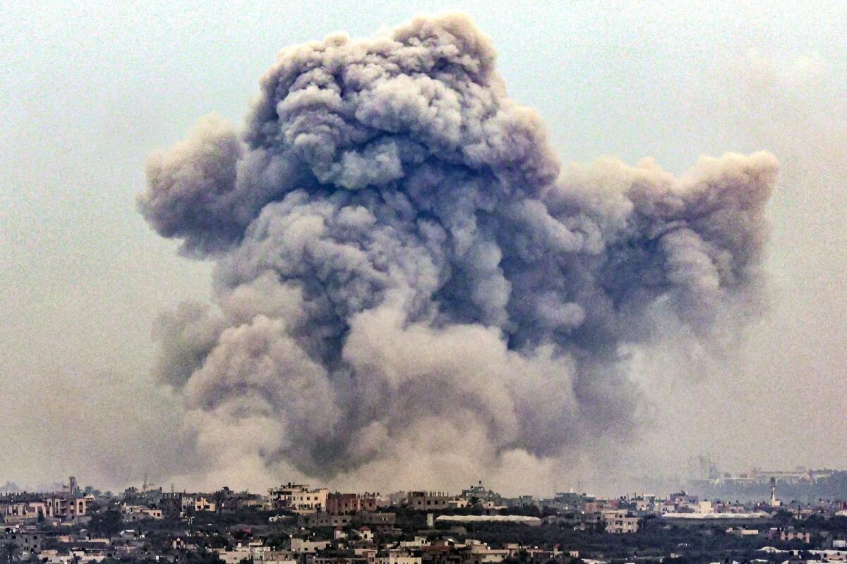 Smoke billows over Khan Yunis from Rafah in the southern Gaza strip during Israeli bombardment earlier this year. — AFP file photo