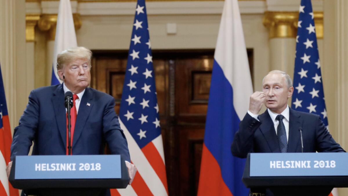 Trump embraces longtime US foe Putin, doubting own intel