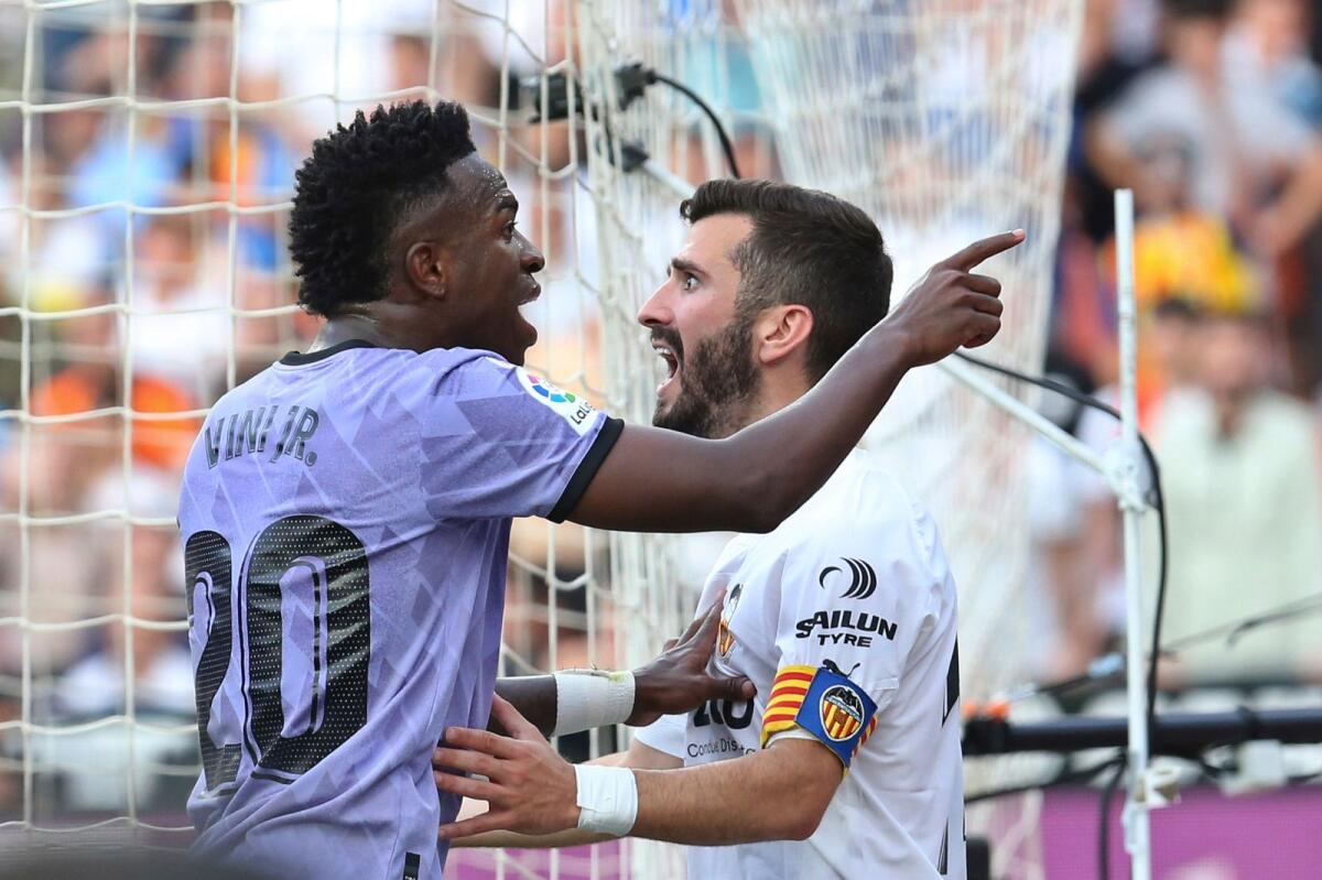 Real Madrid's Vinicius Junior (left) confronts Valencia fans after facing racist abuse during the La Liga. — AP