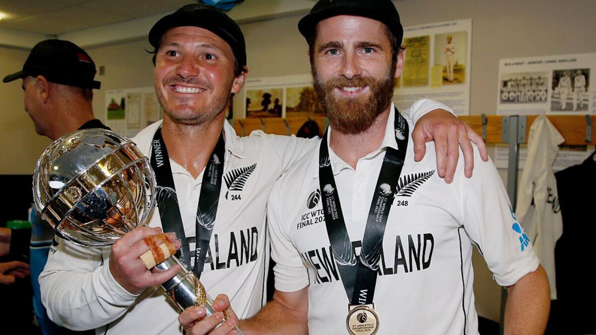 New Zealand captain Kane Williamson along with BJ Watling with the winner's trophy after their win in the World Test Championship final cricket match against India. — ANI