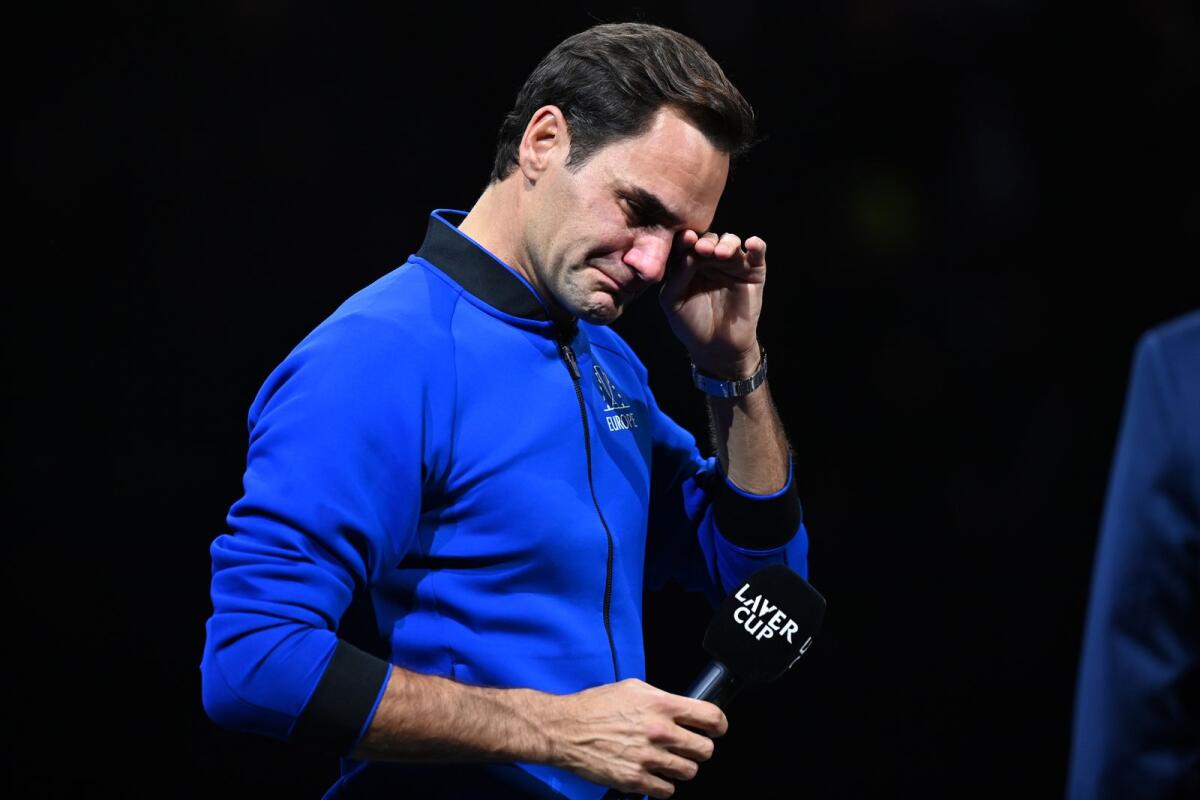 Roger Federer struggles to hold back the tears during the post-game speech after playing the final match of his incredible career. (AFP)