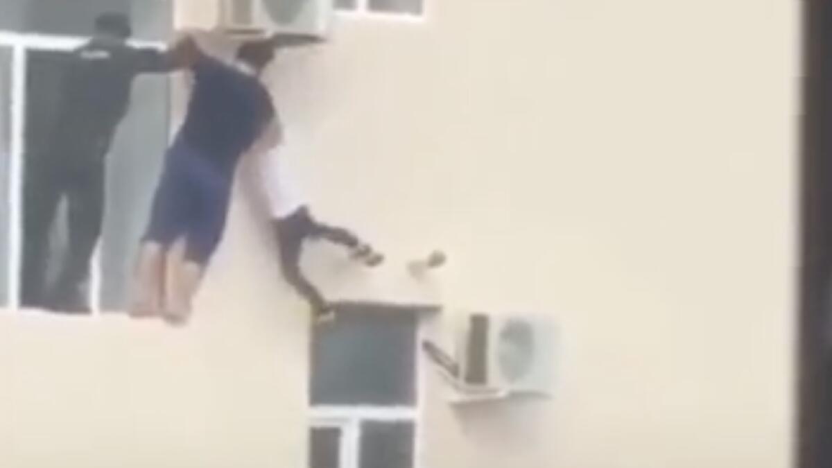 Child stuck outside building in harrowing video; how did he get there?