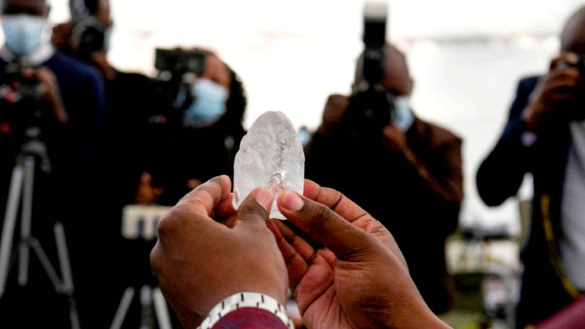 A Botswana cabinet member holds the 1,098-carat diamond in Gaborone. — AFP