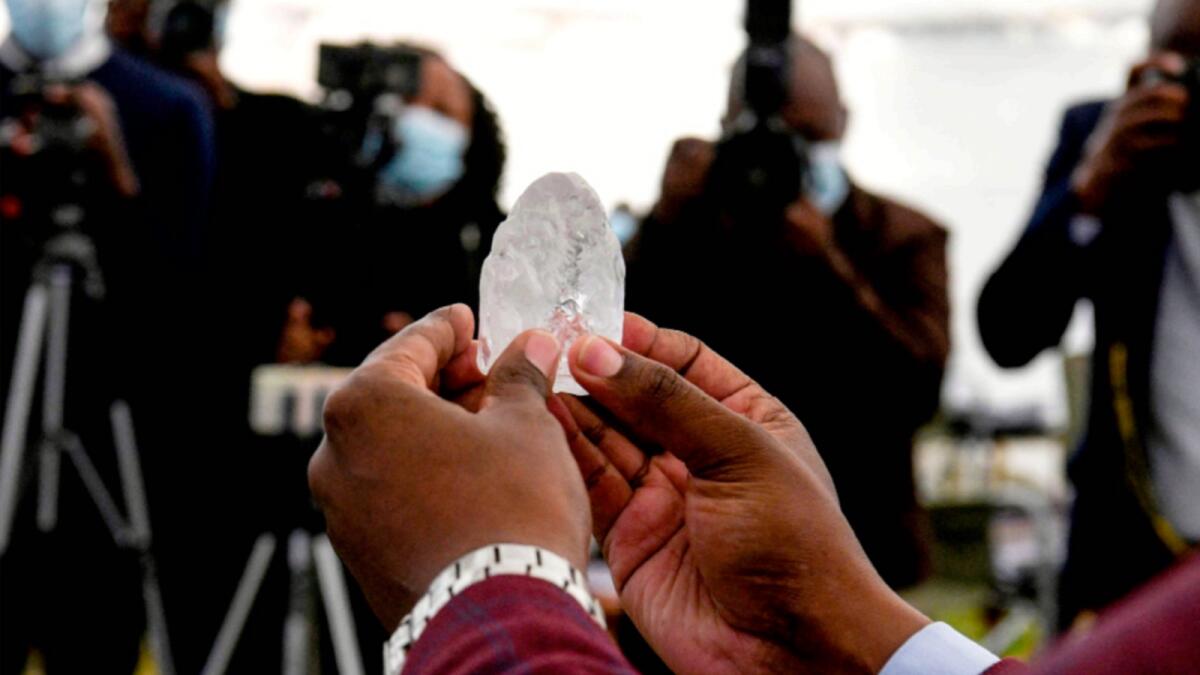 A Botswana cabinet member holds the 1,098-carat diamond in Gaborone. — AFP
