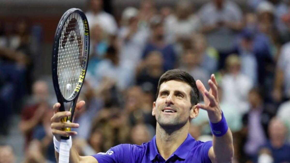 Novak Djokovic of Serbia celebrates his win on Thursday. (Reuters)