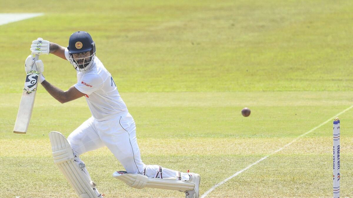 Dimuth Karunaratne plays a shot during the fifth and final day of the first Test against  Bangladesh. — AFP