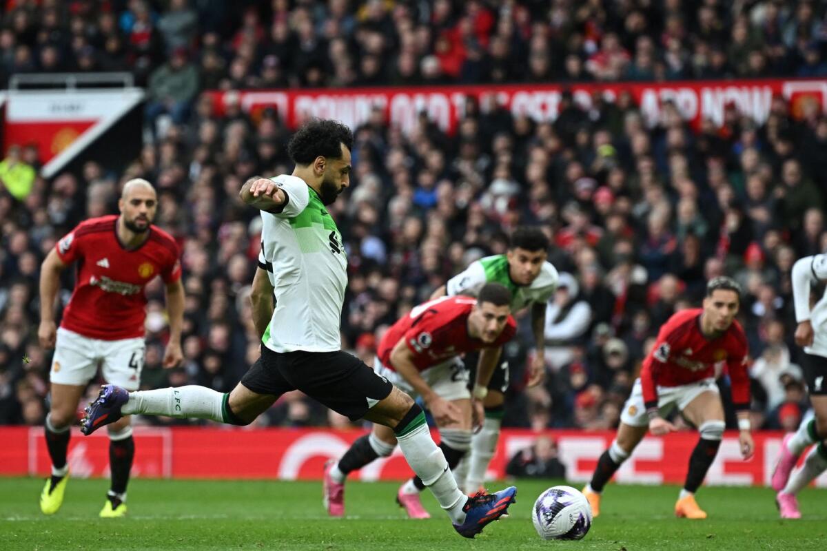 Liverpool's Egyptian striker Mohamed Salah scores their second goal from the penalty spot. — AFP