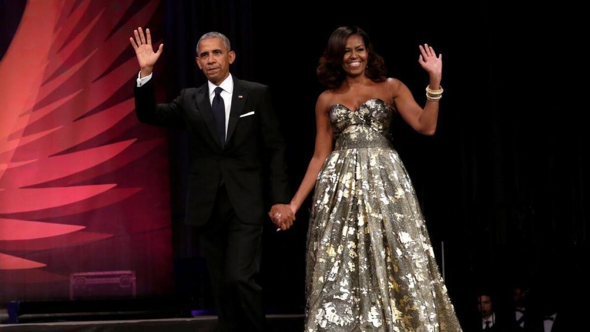 US President Barack Obama and First lady Michelle Obama arrive at the Congressional Black Caucus Foundation's 46th annual Legislative Conference Phoenix Awards Dinner in Washington.- Reuters 