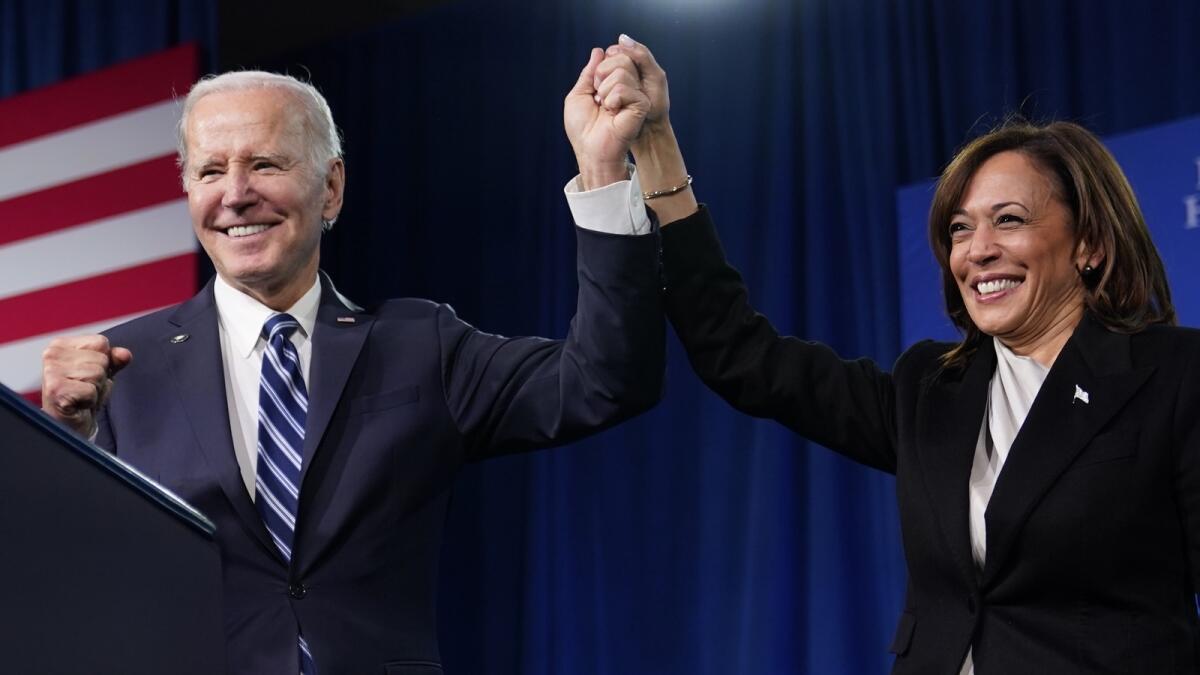 President Joe Biden and Vice-President Kamala Harris stand on stage at the Democratic National Committee winter meeting on Feb. 3, 2023, in Philadelphia. — AP