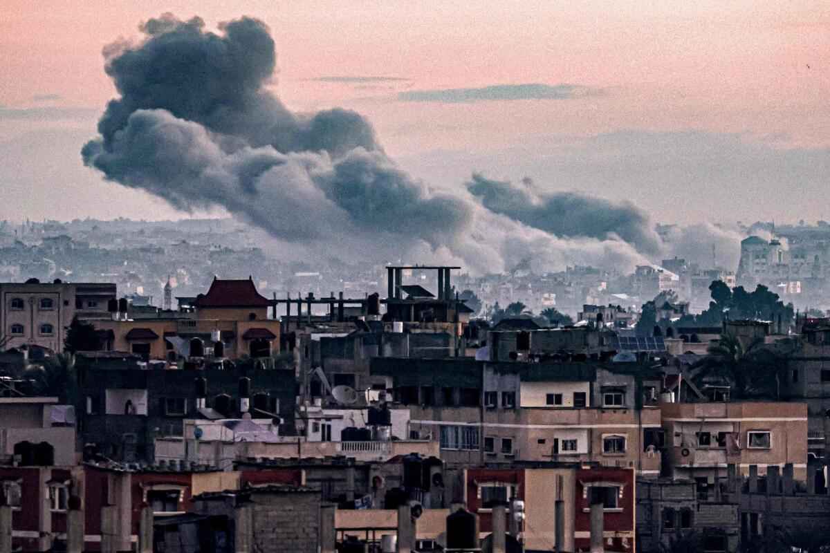Smoke billows during Israeli bombardment on Khan Yunis from Rafah in the southern Gaza Strip early on Wednesday. — AFP