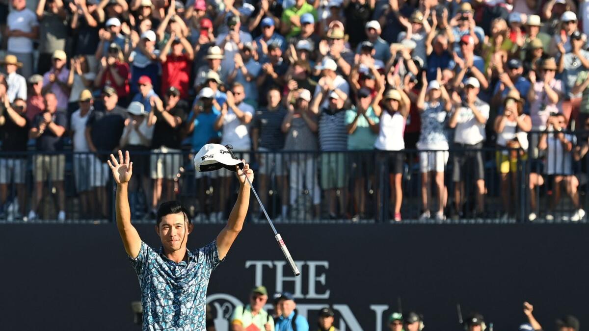 Collin Morikawa celebrates after winning the British Open. (AFP)