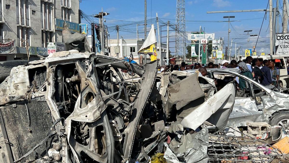 Wreckages of vehicles destroyed at the scene of an explosion along K5 street in Mogadishu. — Reuters