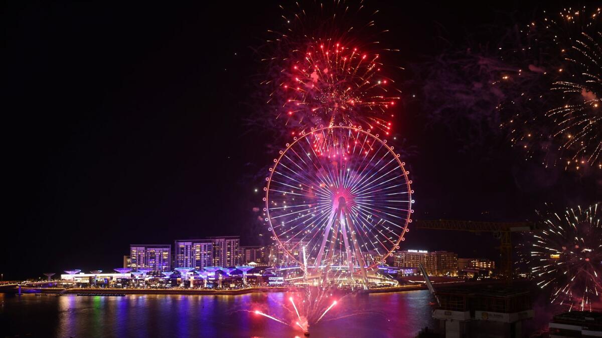 A picture taken on December 31, 2021 shows fireworks erupting  in front of Ain Dubai (the Dubai Eye -- the world’s largest and tallest observation wheel) as part of the New Year's festivities in the Gulf emirate of Dubai. (Photo: AFP)
