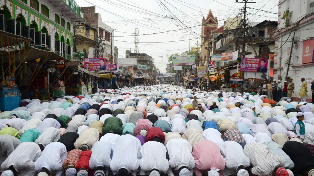 Muslims in India offer prayers on the last Friday prayers of the holy month of Ramadan, ahead of the Muslim festival of Eid Al Fitr, on a street outside the Jama Masjid in Allahabad.