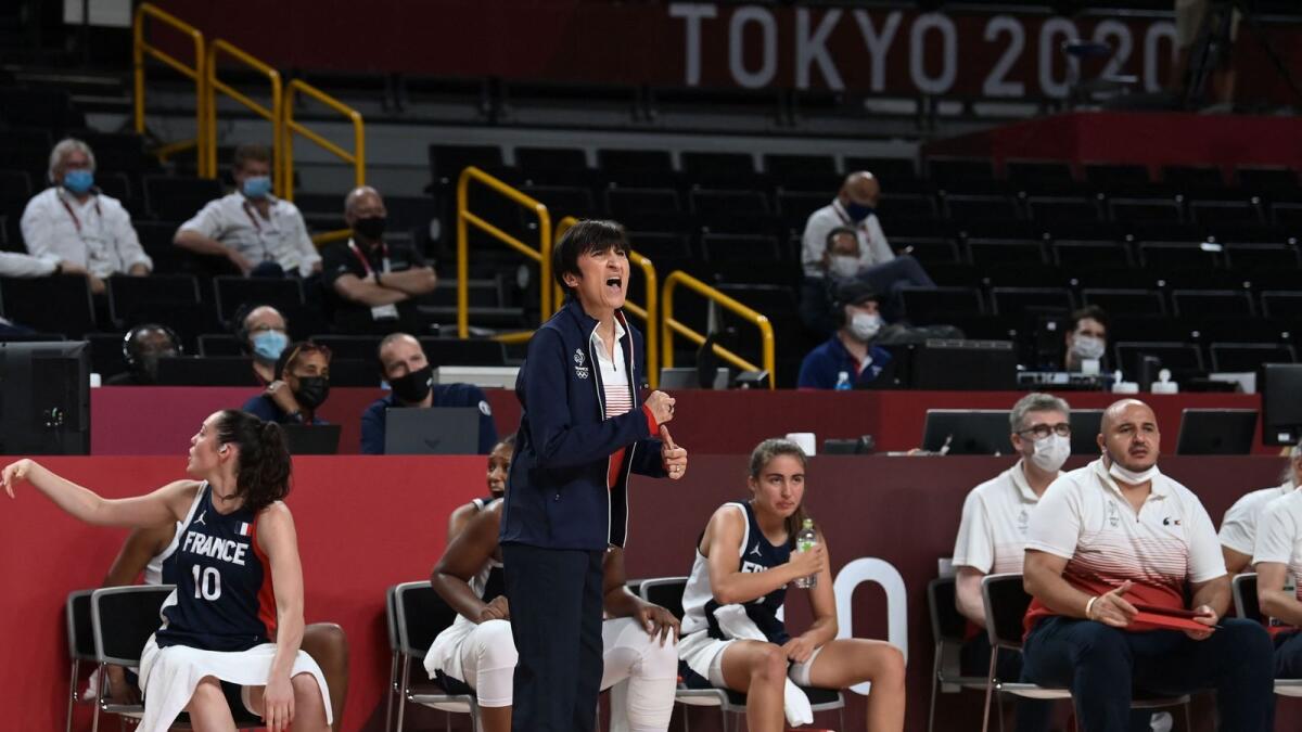France's coach Valerie Garnier (centre) gestures from the sideline during the women's bronze medal basketball match against Serbia. — AFP