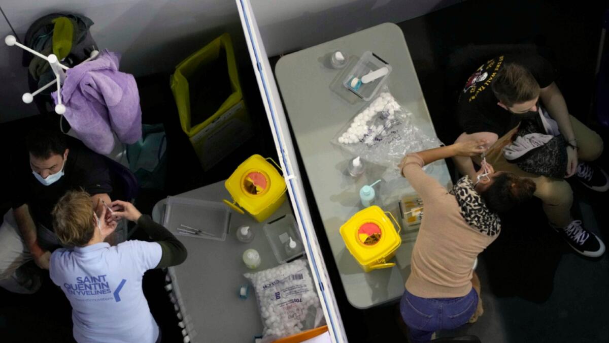 People receive Moderna Covid-19 vaccine at the National Velodrome in Saint-Quentin-en-Yvelines, west of Paris. — AP