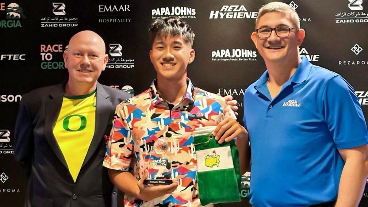 Winner of the Race to Georgia U21 Division, Thanawat Puangsaroj (centre), with Club Captain Chris Rossmeisi (left) and Jacabu Grierson (right) from REZA Hygiene, at the recent qualifier at Abu Dhabi Golf Club. - Supplied photo