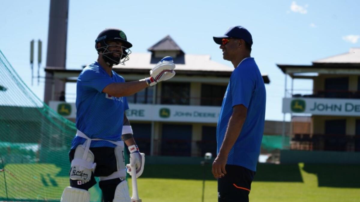 Indian coach Rahul Dravid (right) with captain Virat Kohli during a nets session. (BCCI Twitter)
