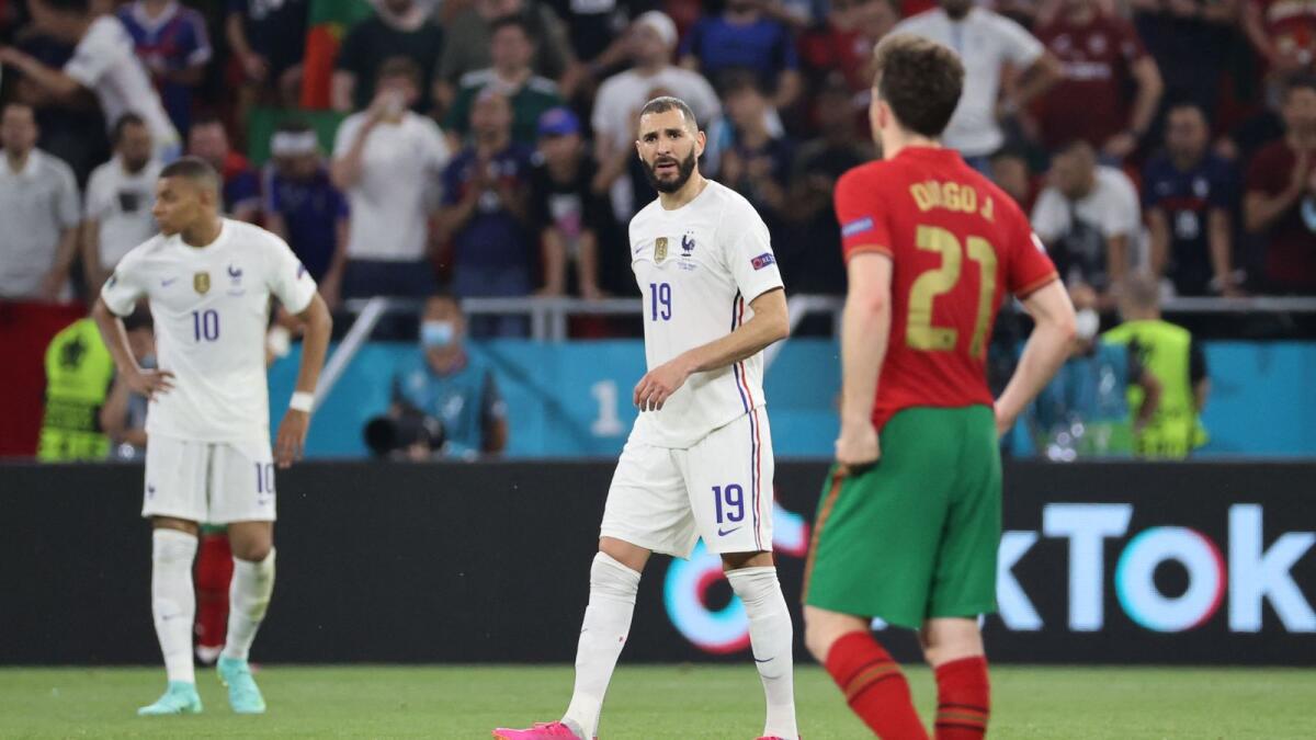 France's forward Karim Benzema reacts during the Euro 2020 match against Portugal.— AFP