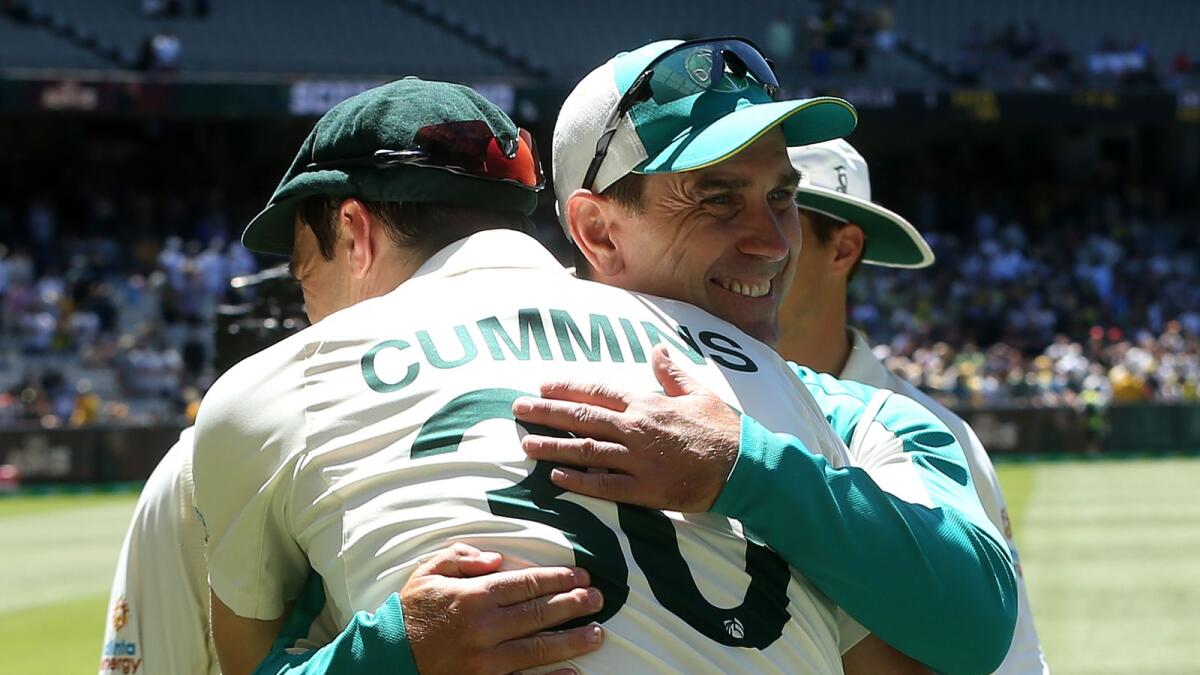 Australian Test captain Pat Cummins (left) and Justin Langer. — AFP