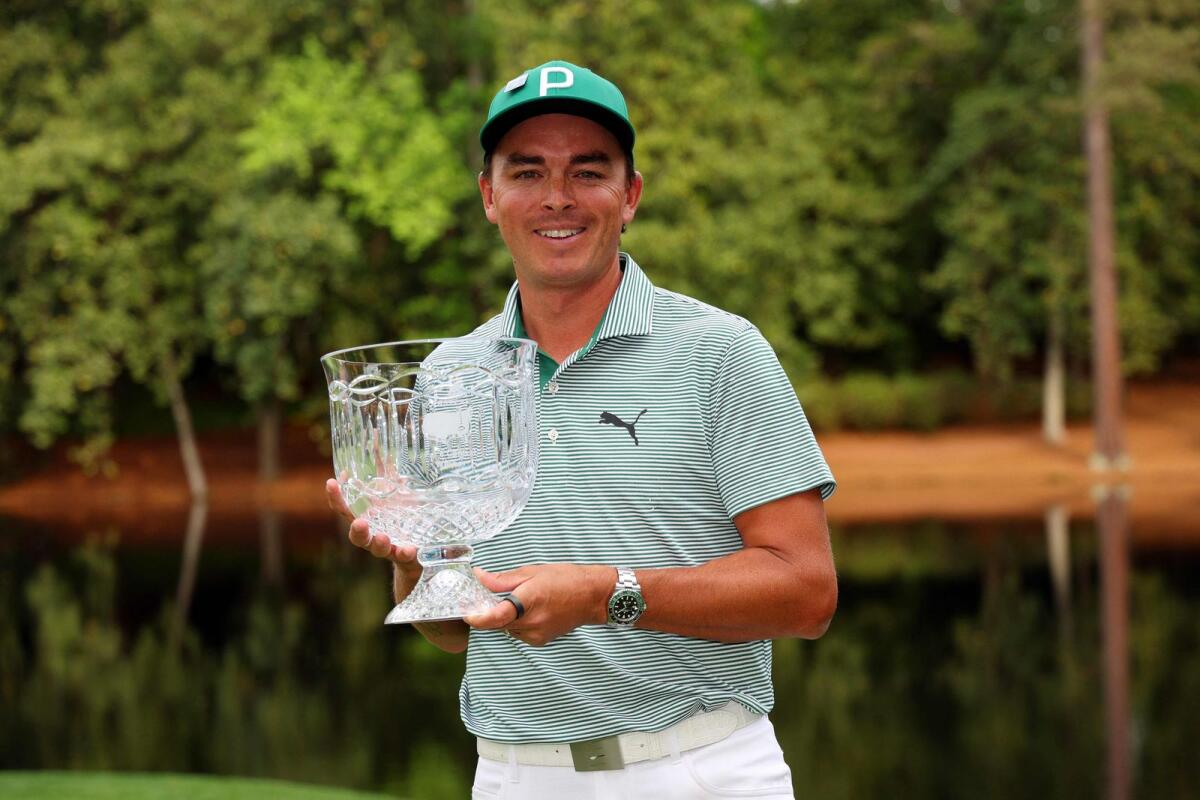 Rickie Fowler of the United States celebrates after winning the Par Three Contest prior to the 2024 Masters. - AFP